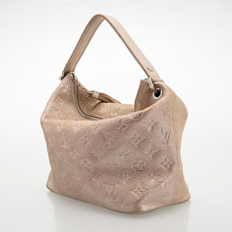 Louis Vuitton, a shimmer 'Halo' bag.