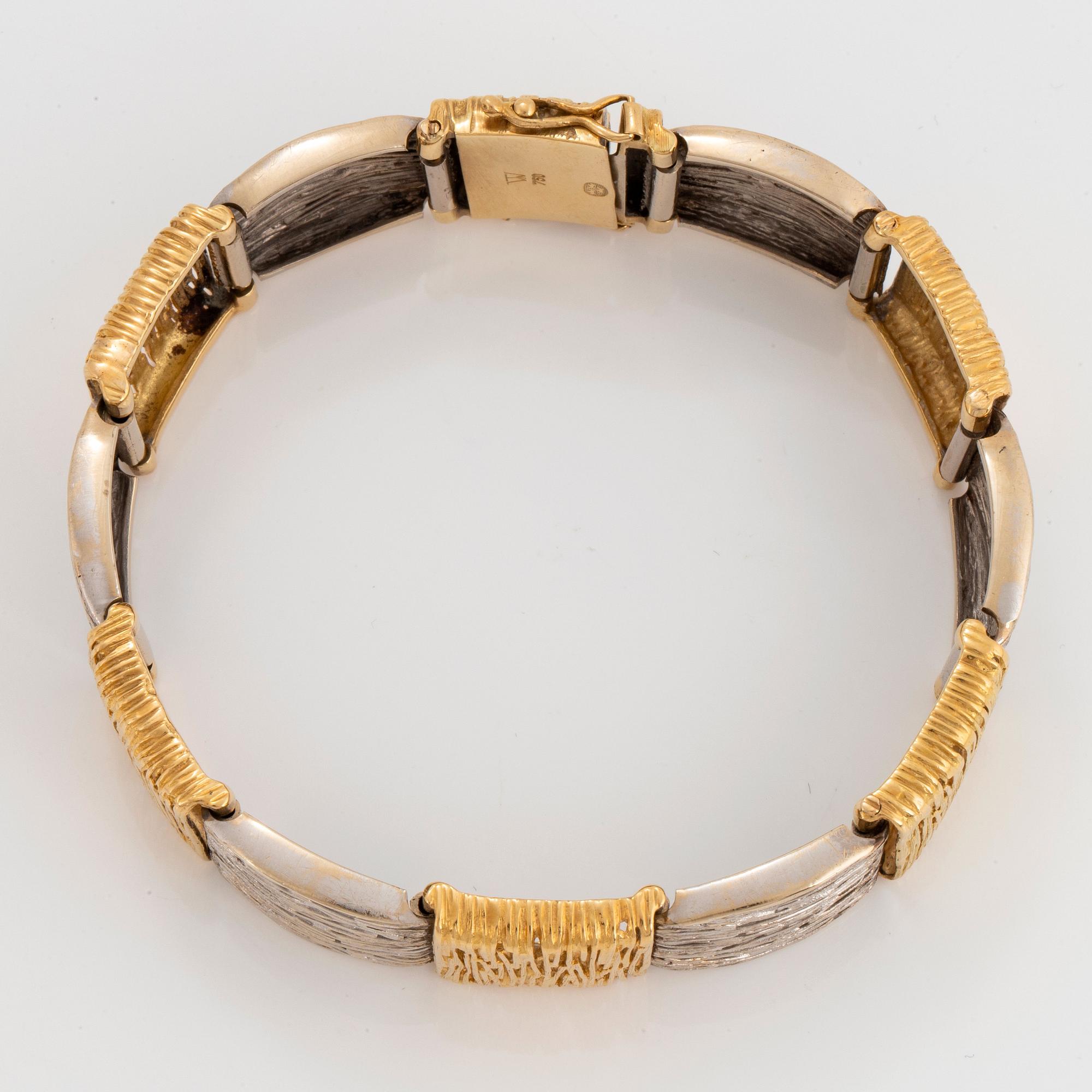An 18K gold and white gold bracelet.