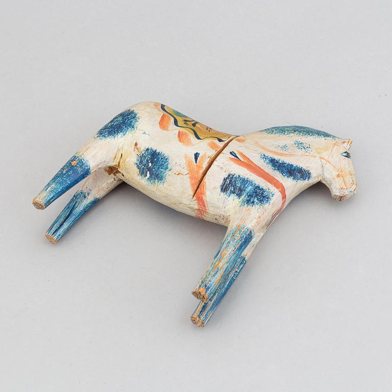 A wooden carved and painted 'Dalahäst', early or mid 20th century.