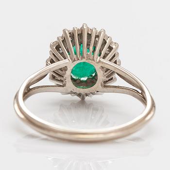 A 14K white gold ring, with an emerald and single-cut diamonds. Finnish import marks.