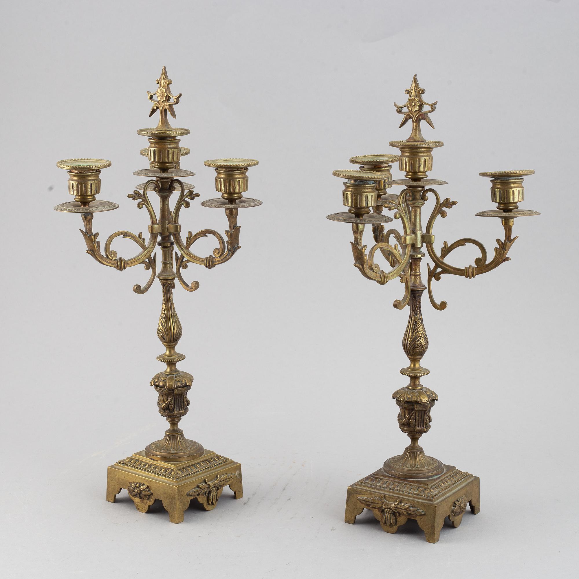 A mantle clock with pair of candelabra, late 19th century.