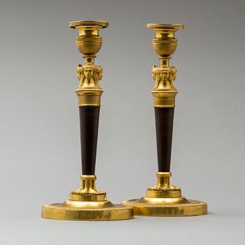 A pair of French Empire early 19th century candlesticks.