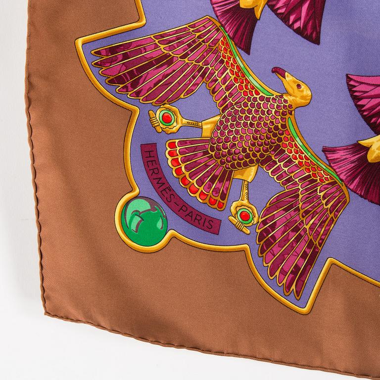 A silk scarf by Hermès.