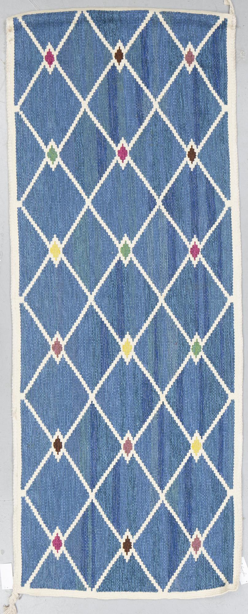 A runner, tapestry weave, ca 246 x 97 cm.