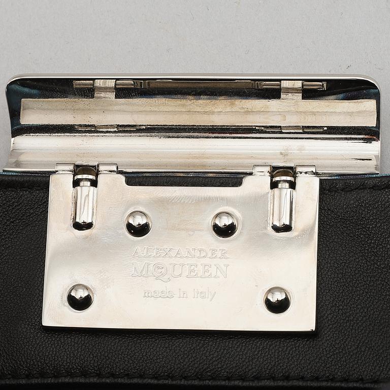 Alexander McQueen, a fabric clutch.