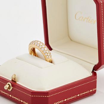 A brilliant cut diamond ring by Cartier.