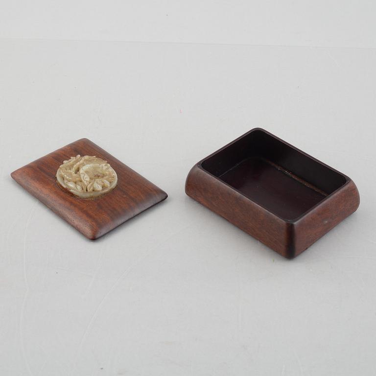 Two Chinese hardwood boxes with nephrite plaques, 20th century.