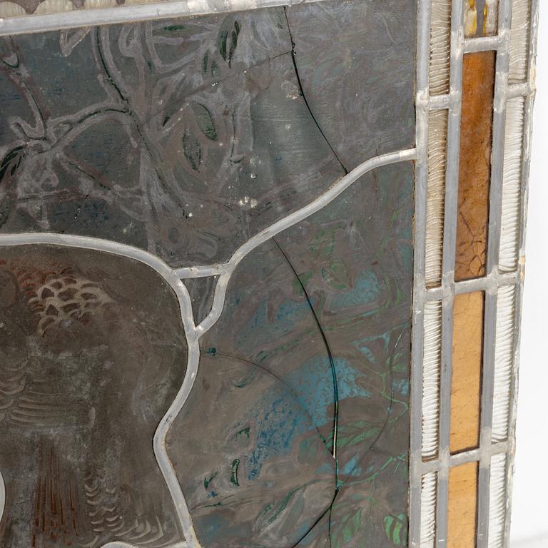 A pair of stained glass windows, circa 1900.