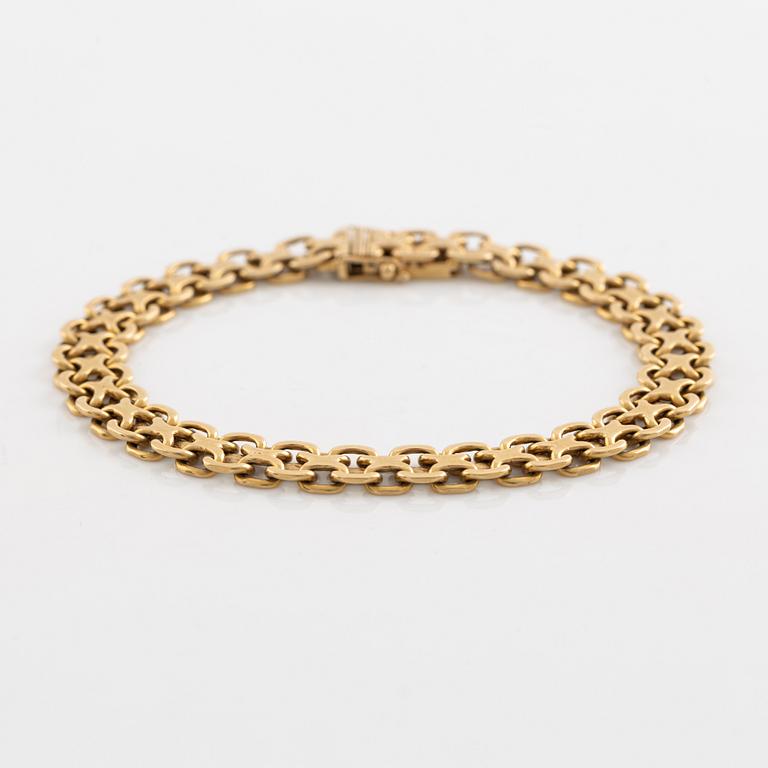 Armlänk, "x-länk", 18K guld. Bolidenguld.