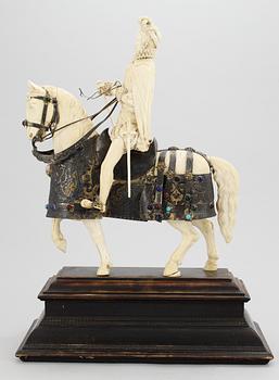 A late 19th century equestrian ivory, wood and metal statue.