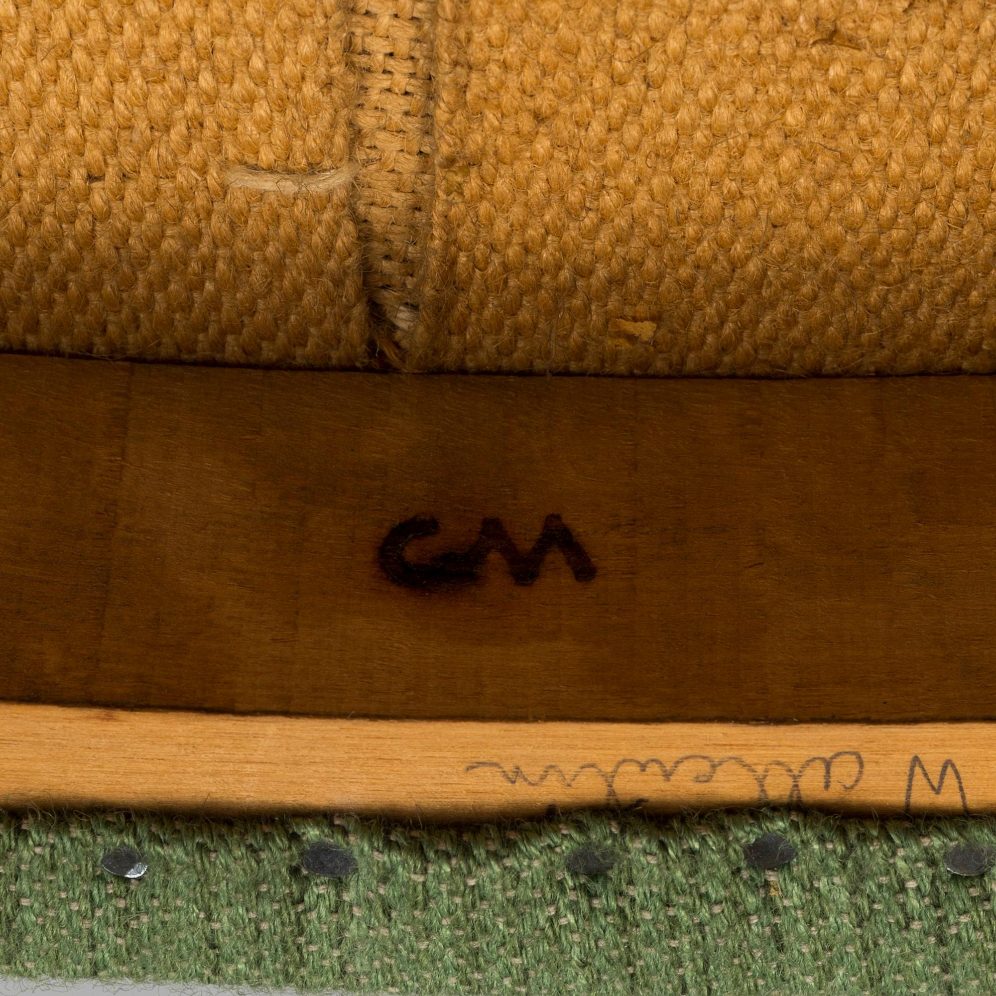 A "Lata Greven" armchair by Carl Malmsten.