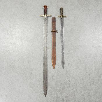 Two East African Kaskara swords- One with scabbard. 19-20th Century.