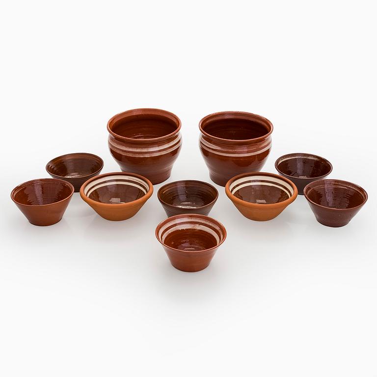 A set of ten redclay servingbowls.