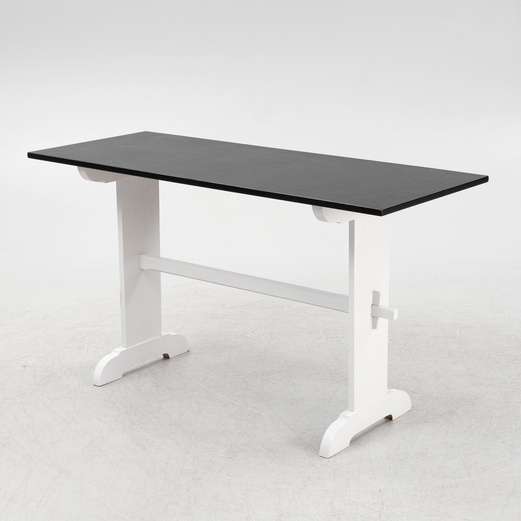 A painted table, 20th Century.