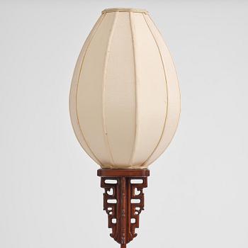 A Chinese wooden floor lamp, later part of the 20th century.