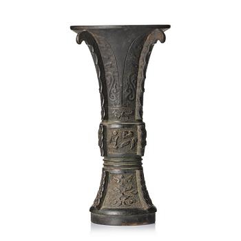 1024. An archaistic bronze vase, Gu, late Ming dynasty/early Qing dynasty.