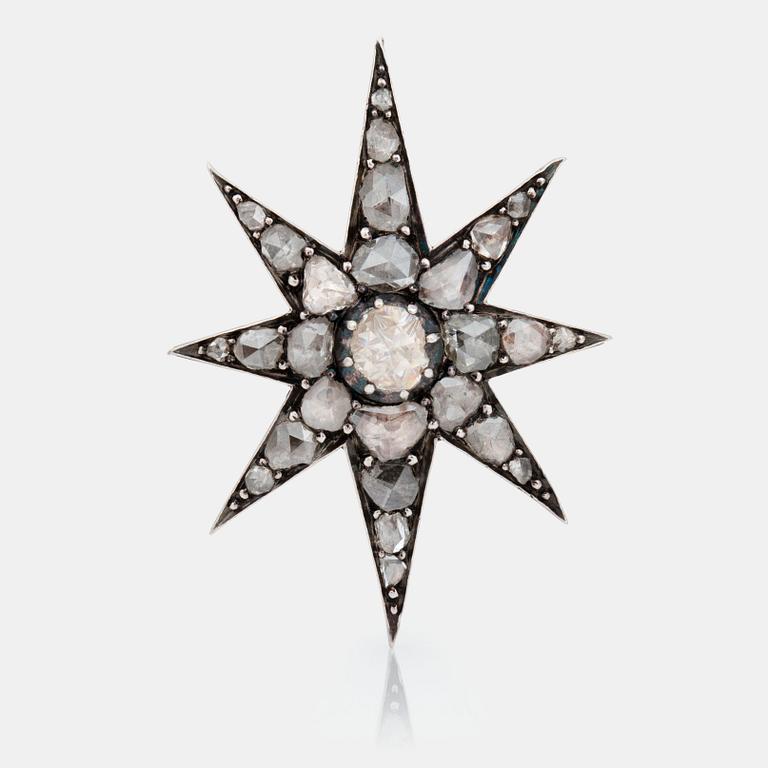 A Victorian star brooch set with rose-cut diamonds.