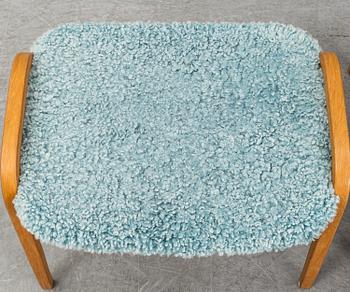 YNGVE EKSTRÖM, a 'Lamino' armchair with a stool, Swedese.