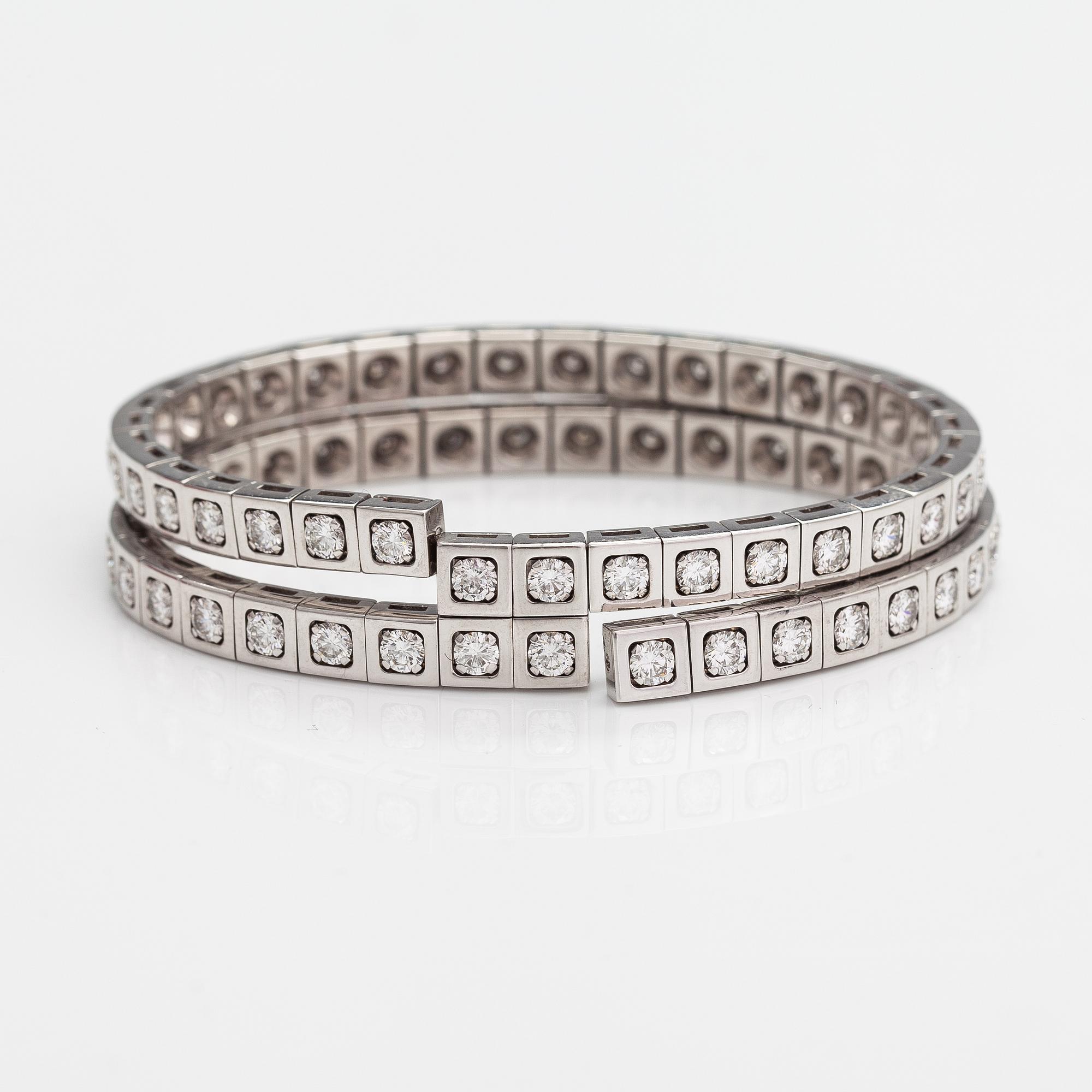 Cartier, Rannekoru "Tectonique", 18K valkokultaa, briljanttihiottuja timantteja n. 11.90 ct yht. Merkitty CT6808, JC.