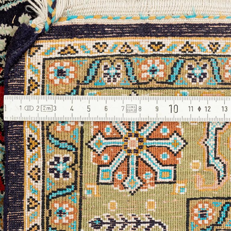 A rug, silk Quum, ca 121 x 76 cm.