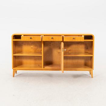 Am elm bookshelf from the first half of the 20th century.