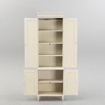 A contemporary Gustavian style cabinet.