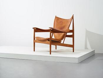 Finn Juhl, a teak and natural brown leather "Chieftain Chair" by Niels Vodder, 1950-60's.