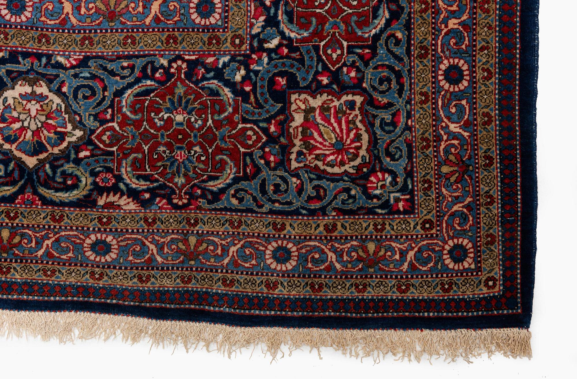 A semi-antique Kashan 'Dabir' carpet, central Persia (Iran), c. 437 x 299 cm.