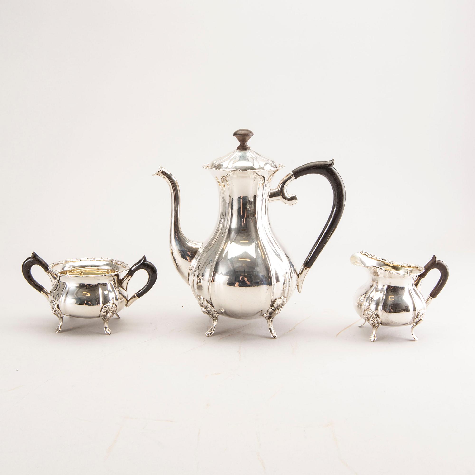A 20th century German three parts silver tea service with Swedish import stamps.