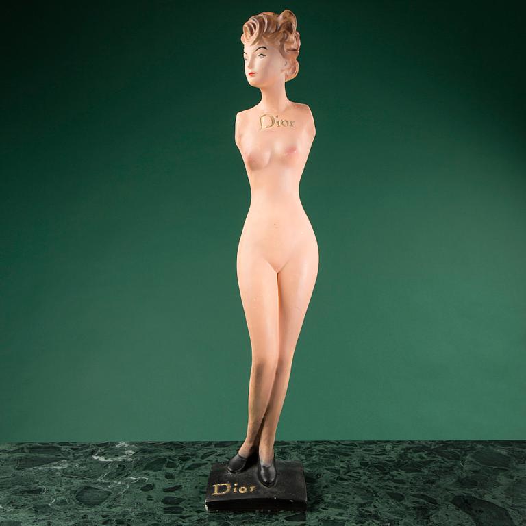 a Christian Dior mannequin doll, probably from the 1950s.
