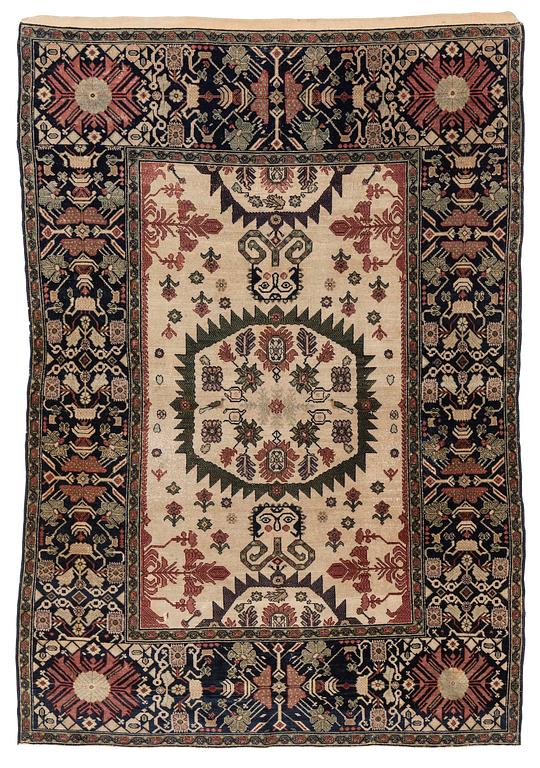 An antique Malajir rug, c. 179,5 x 124 cm (as well as one end with 2.5 cm flat weave).