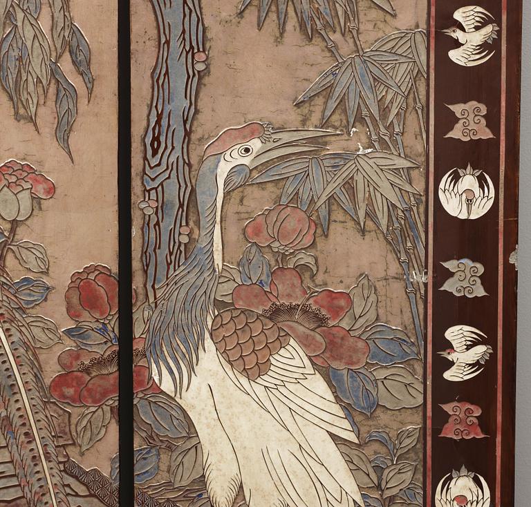 A coromandel black-lacquer four panel screen, Qing Dynasty (1644-1912).