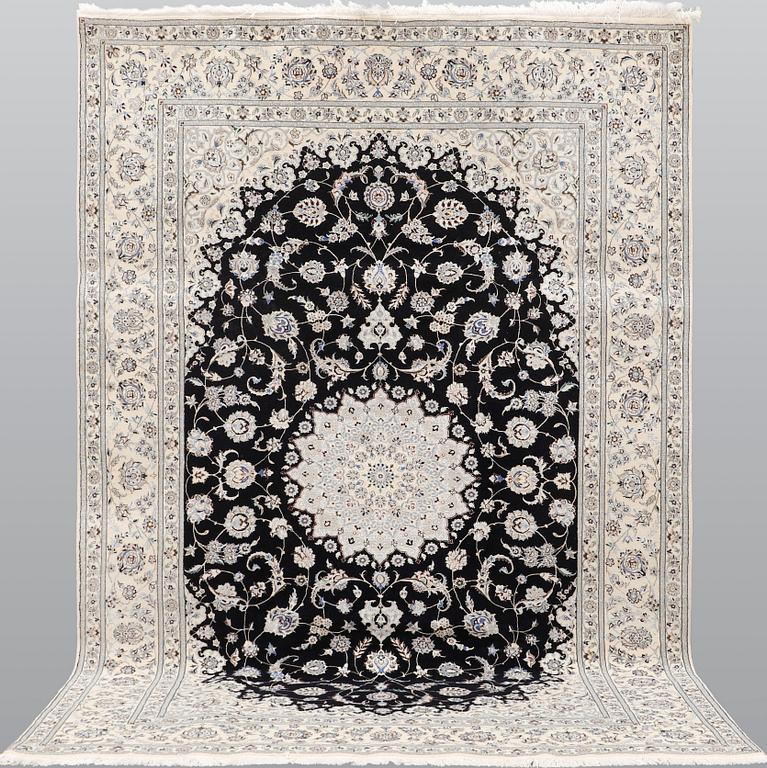 A Nain part silk carpet, 310 x 204 cm.