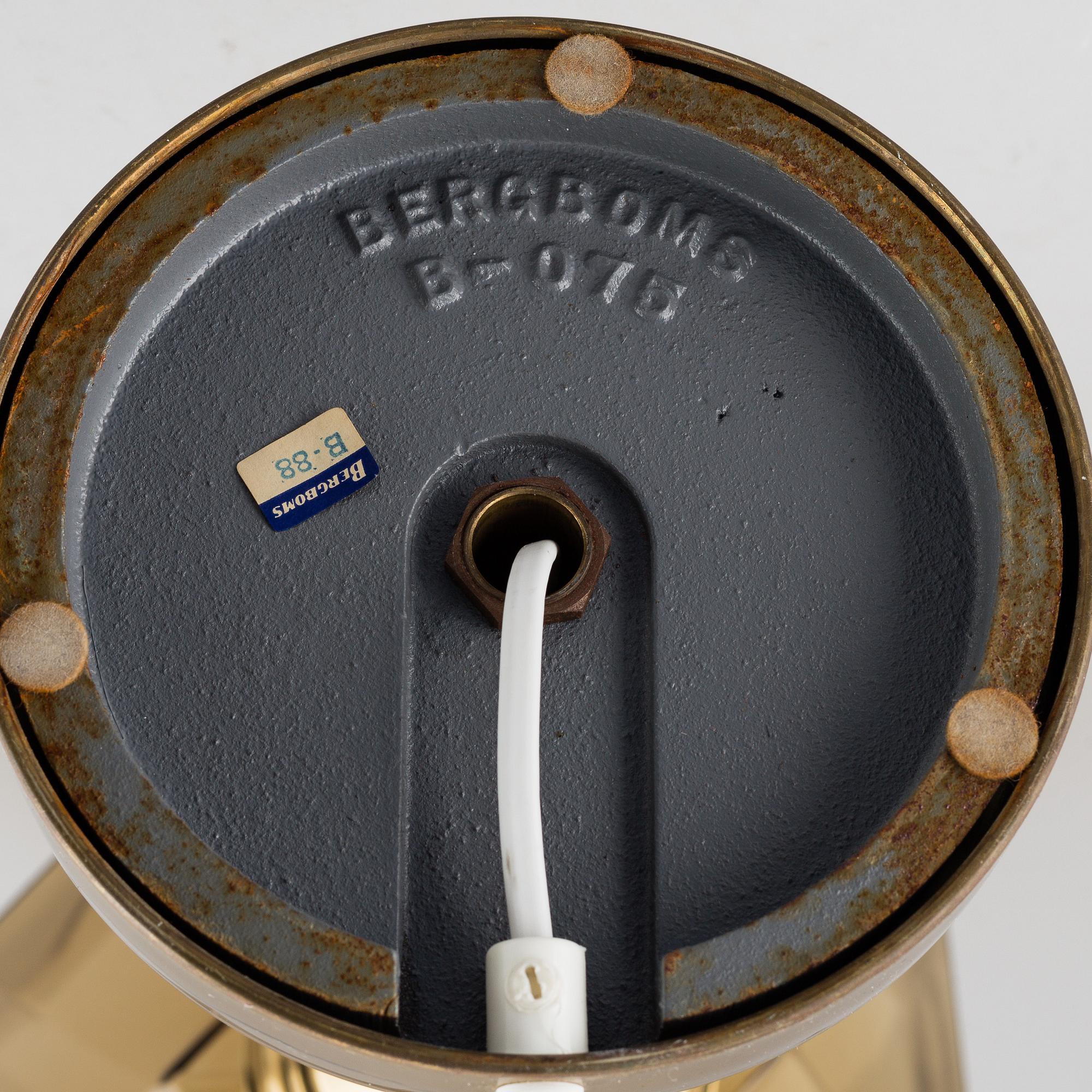 A decond half of the 20th Century brass and glass table light from Bergboms.