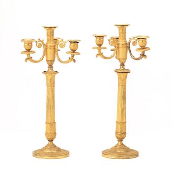 A pair of French Empire early 19th century gilt bronze four-light candelabra.