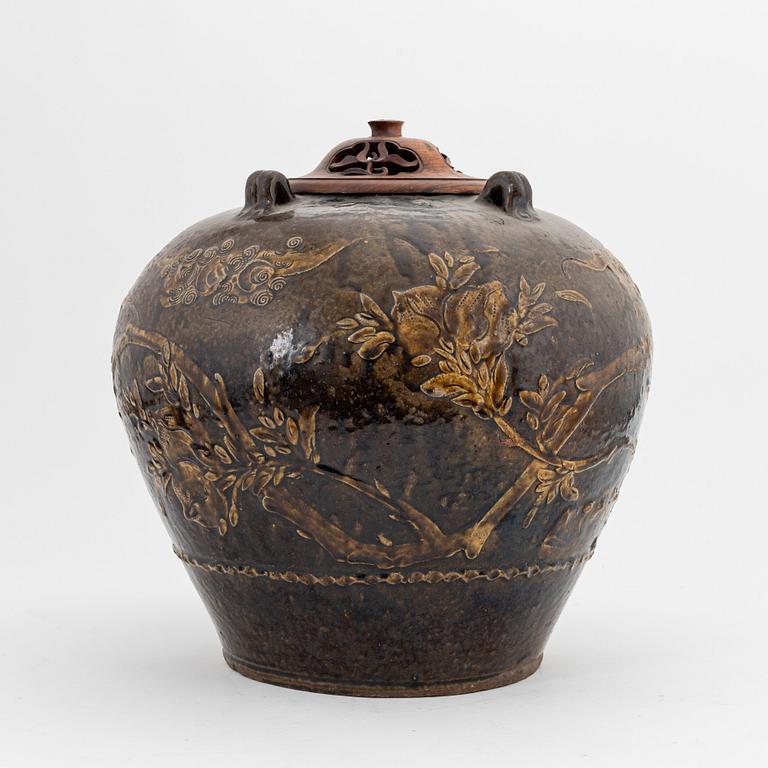 A large brown glazed marthaban jar, presumably late Ming dynasty (1368-1644).
