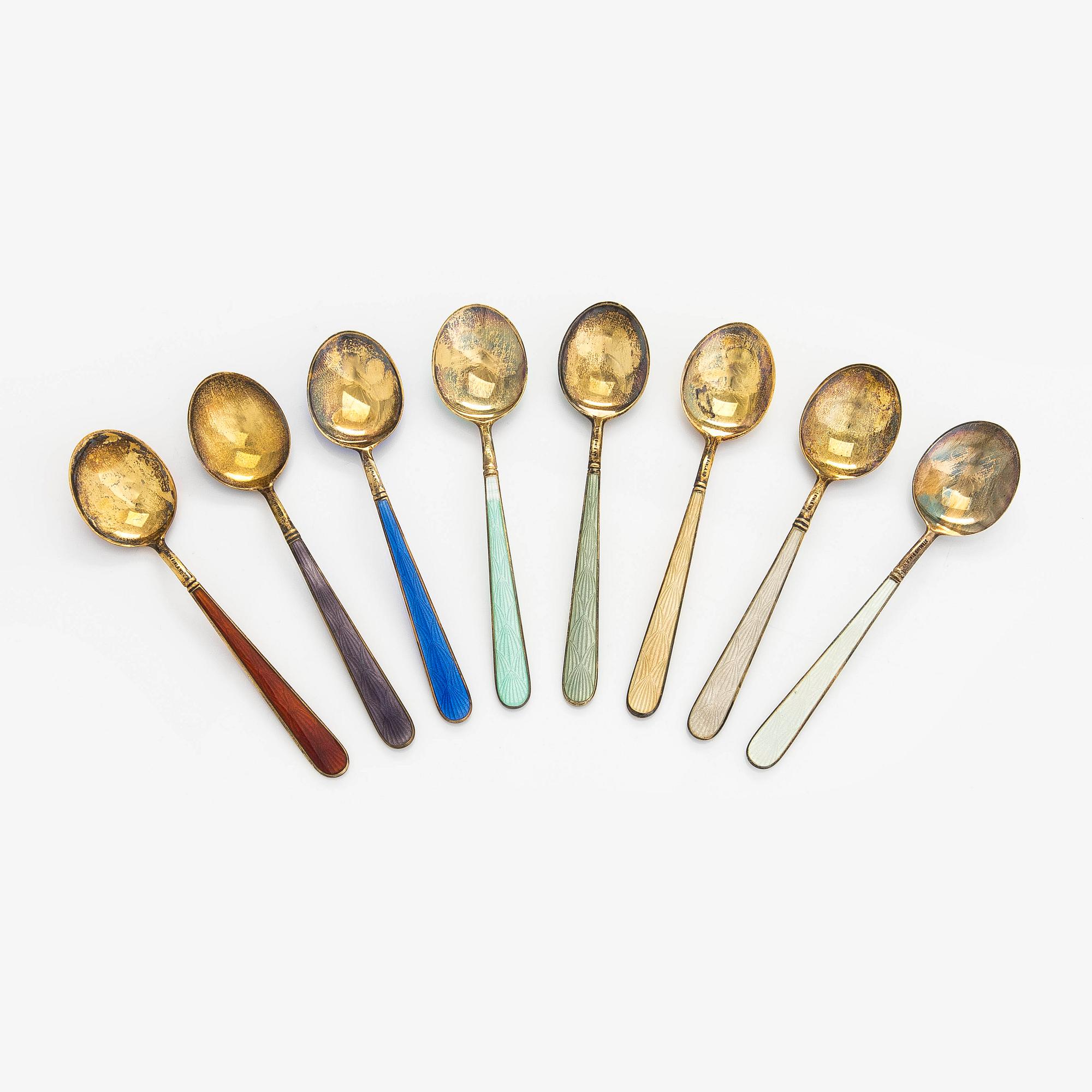 Tillander, an 8-piece set of enamelled and gilt sterling silver coffee spoons, Helsinki 1953. In original box.