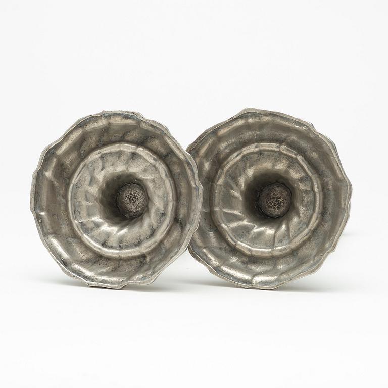 A pair of Swedish Rococo pewter candlesticks by L Lundwall 1762.