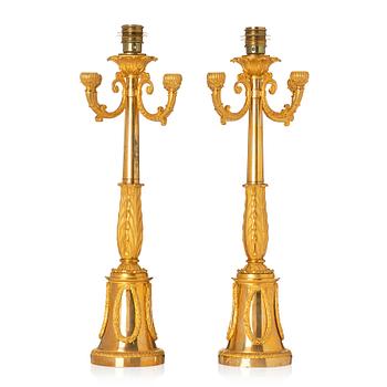 100. A pair of French Empire four-light candelabra (lamps), early 19th century.