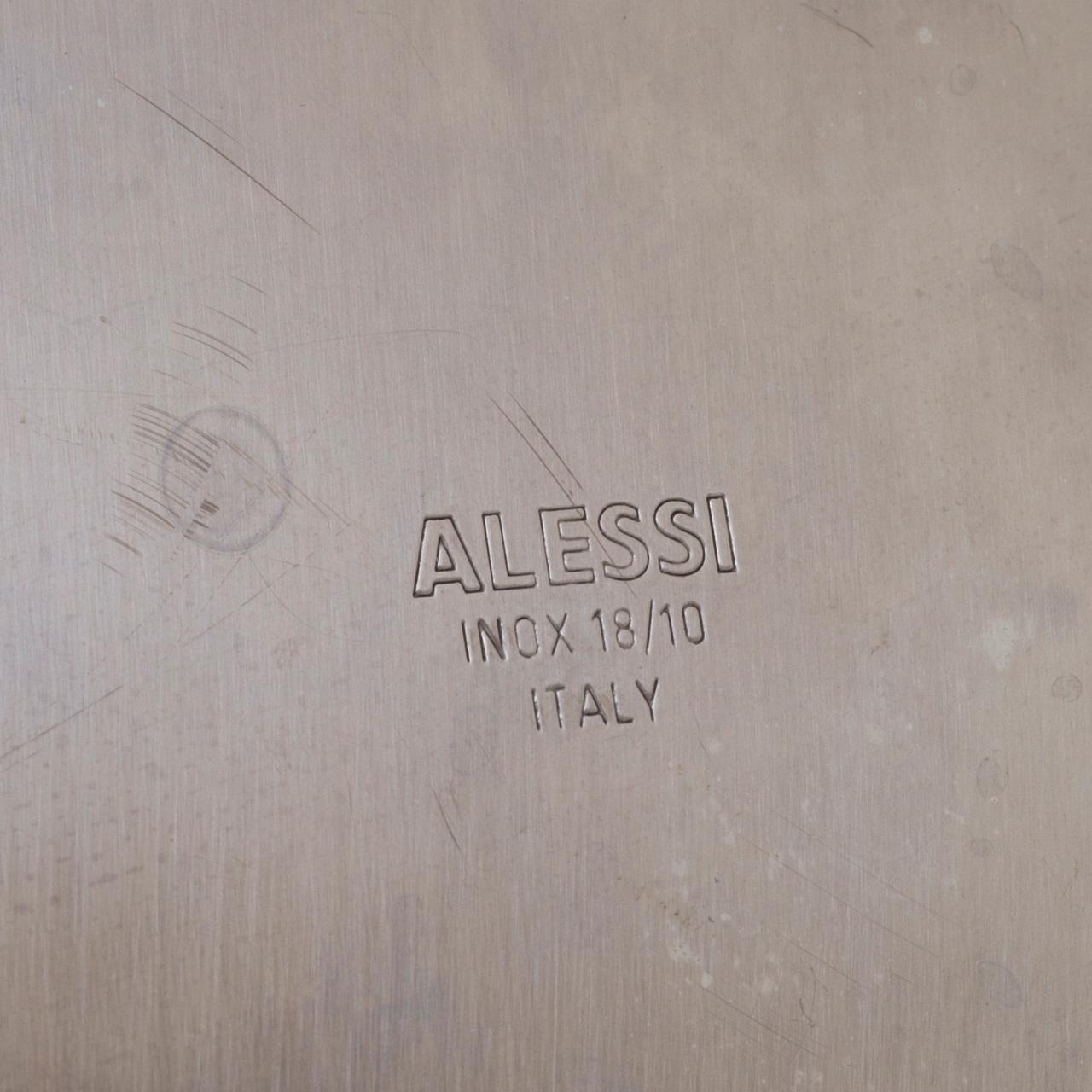 2 pieces of Alessi stainless steel table ware.