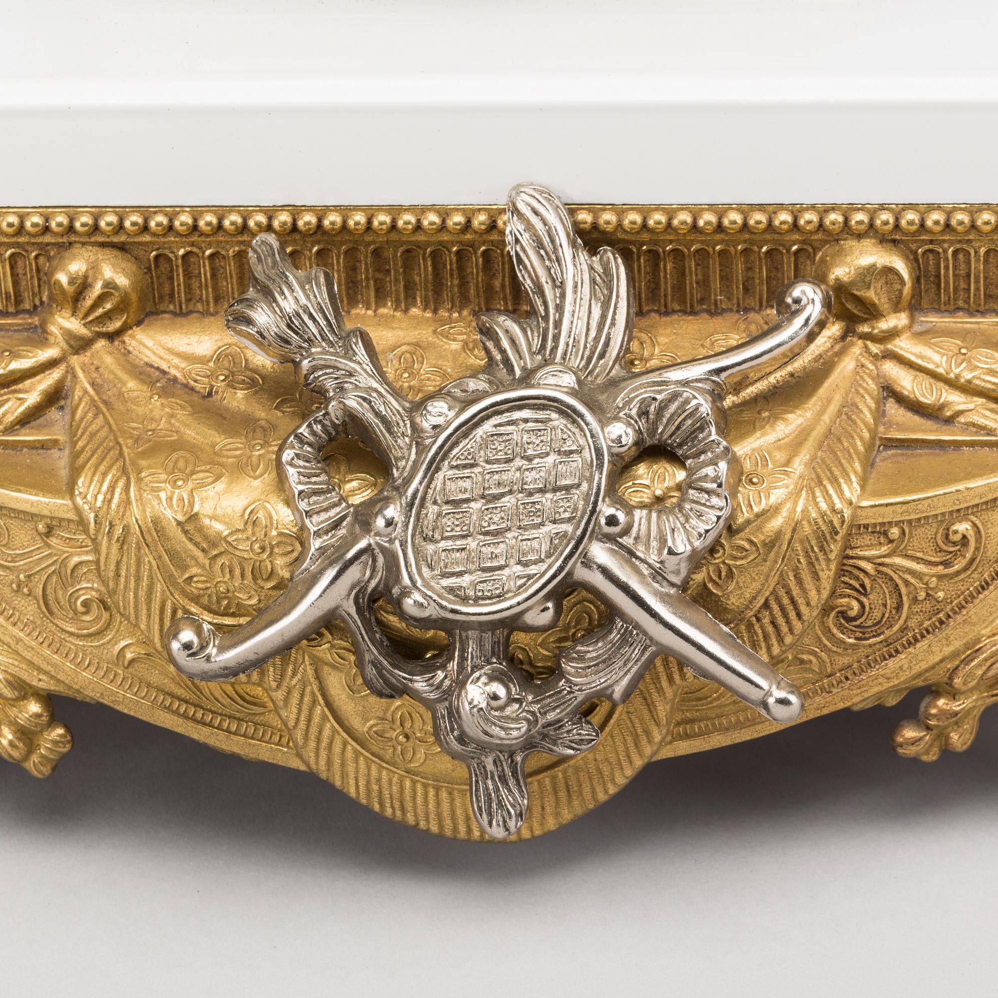 A LOUIS XVI STYLE GILT-BRASS CLOCK GRANITURE. Italy, SECOND HALF OF 20TH CENTURY.
