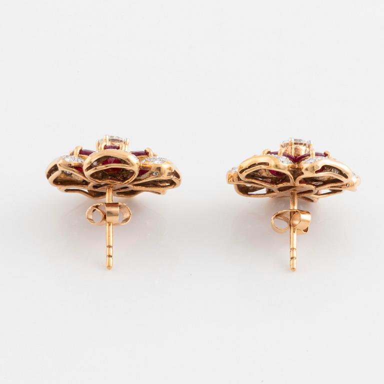 18K gold, ruby and brilliant cut diamond flower earrings.