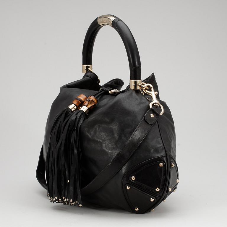 GUCCI, a black leather shoulder bag, "Indy bag".