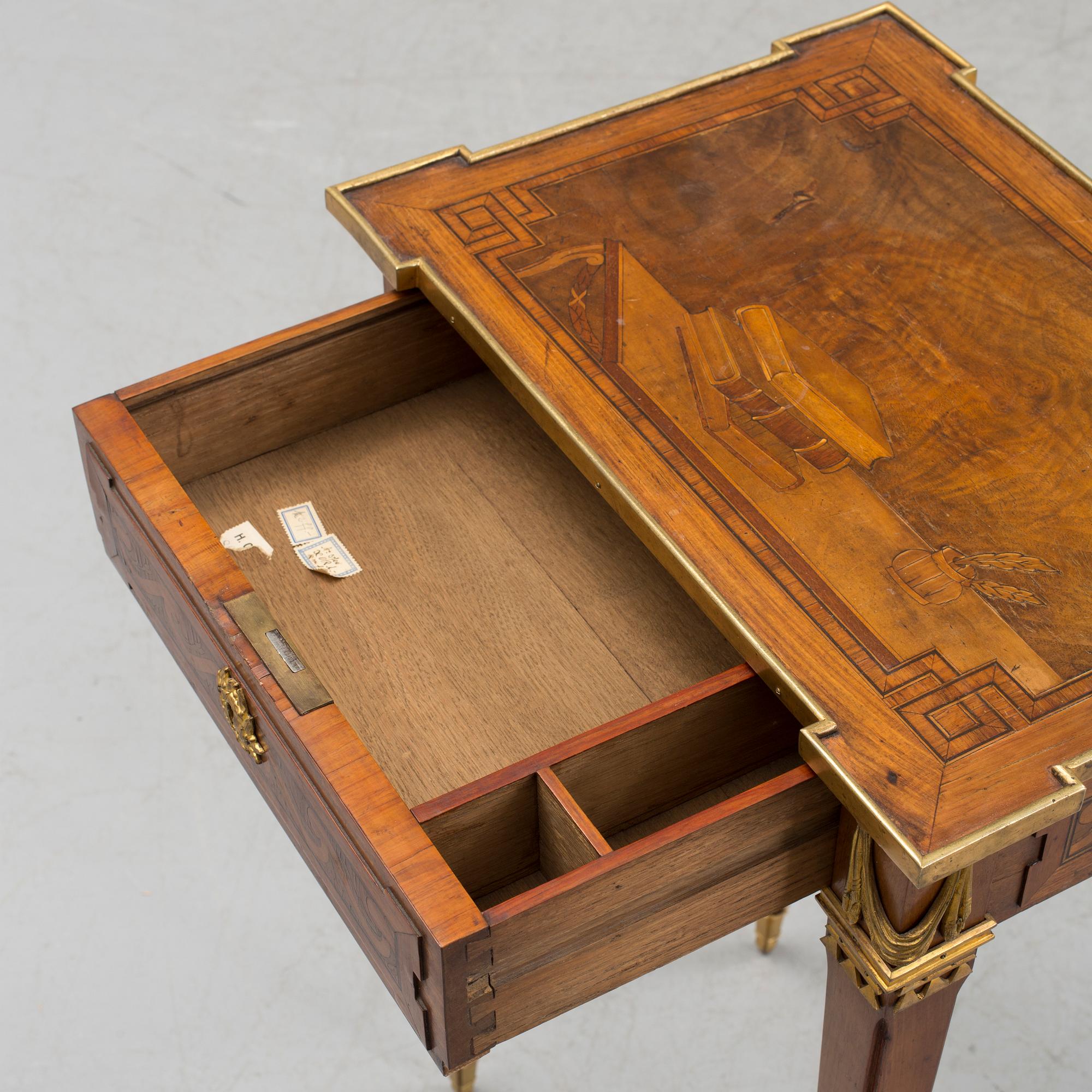 A Louis XVI-style circa 1900 occasional table.