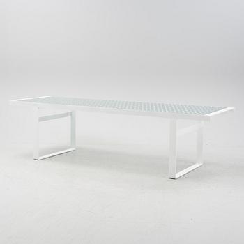 A 'Lens' dining table by Patricia Urquiola for B&B Italia, designed 2003.