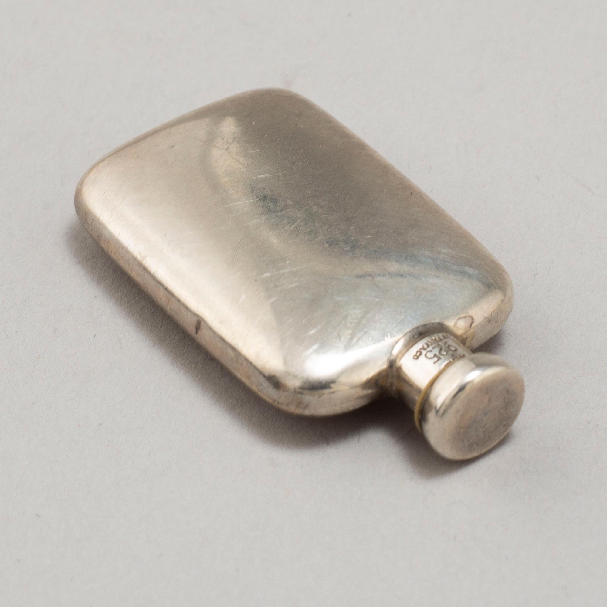 A TIFFANY & CO PERFUME BOTTLE, silver.
