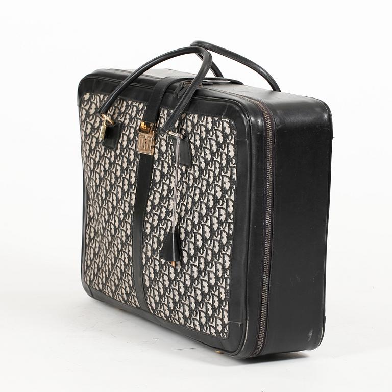 CHRISTIAN DIOR, a black monogram canvas travelling bag.