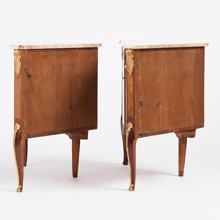 A pair of Gustavian marquetry, ormolu-mounted, and marble encoignures by G. Iwersson (master in Stockholm 1778-1813).