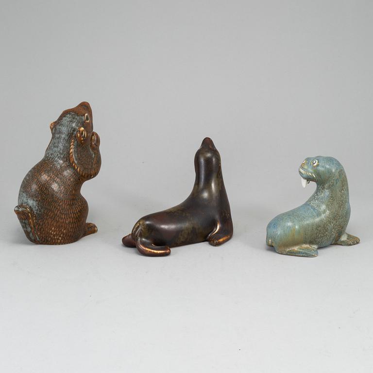 GUNNAR NYLUND, a set of thre stoneware sculptures; a squirrel, a walrus and a seal, Rörstrand, Sweden.