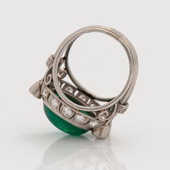 A cabochon cut emerald and brilliant cut diamond ring. Total carat weight circa 0.90 ct.